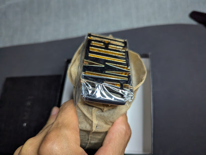 Amiri Belt gold and black logo
