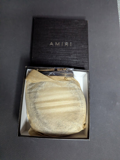 Amiri Belt gold and black logo