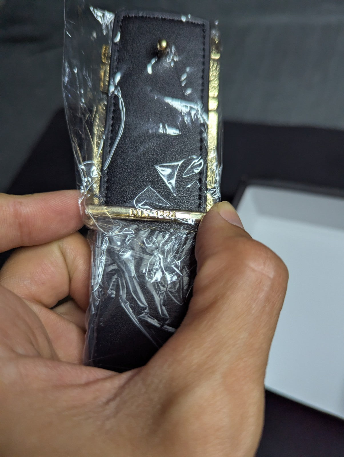 Amiri Belt gold and black logo