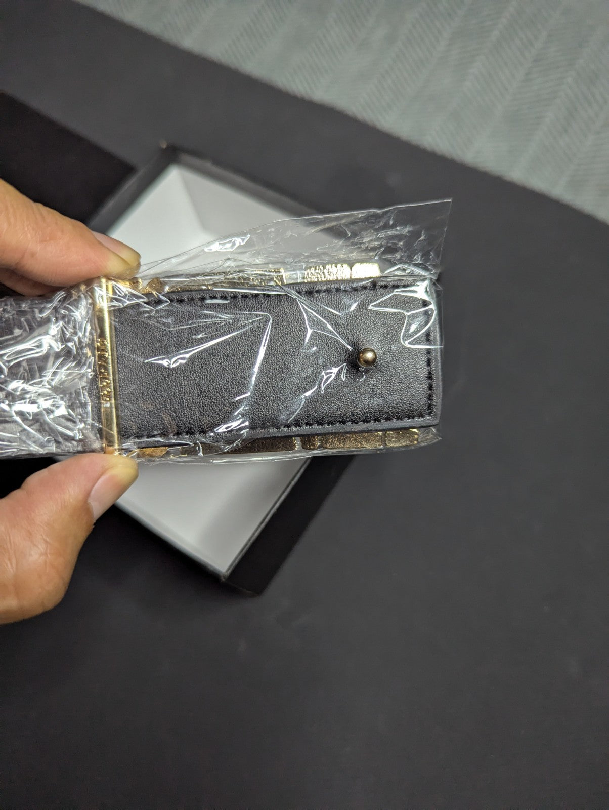 Amiri Belt gold and black logo